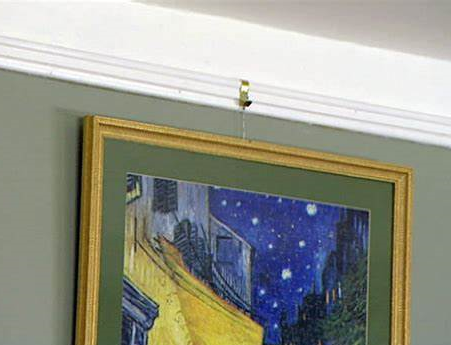 Hanging a picture using picture rail hooks