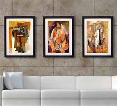 framed pictures hanging on wall